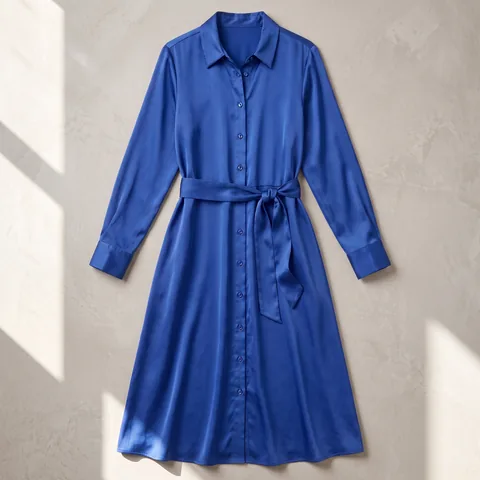 Demo product: flat lay of a cobalt satin tie-front shirt dress